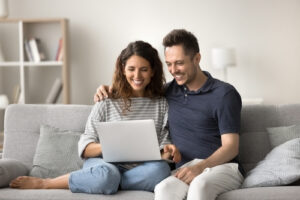 A couple in a video coaching session at home